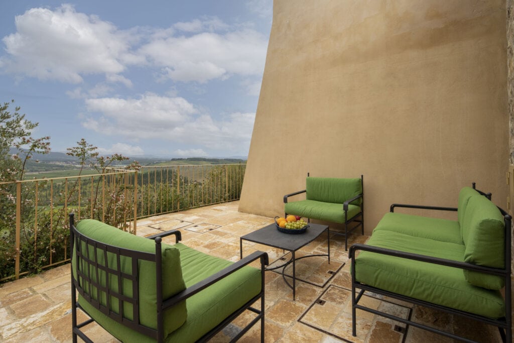 Large terrace with armchairs and sofa overlooking the Tuscan countryside - Bibbiano_Il_Pero_Villa